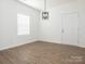 Well-lit living room with wood-look floors and ample natural light from a large window at 1137 Williams St, Rock Hill, SC 29732