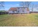 View of the home's backyard, showing the manicured lawn and exterior of the house at 1200 Grace Ave, Kannapolis, NC 28083