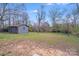 Backyard featuring a detached one-car garage and a spacious lawn at 1200 Grace Ave, Kannapolis, NC 28083