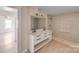 Bright bathroom featuring a double vanity, decorative mirror, and a tiled walk-in shower at 1200 Grace Ave, Kannapolis, NC 28083