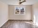 Cozy bedroom with hardwood floors, natural light from the window, and a ceiling fan at 1200 Grace Ave, Kannapolis, NC 28083
