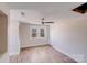 Bright bedroom with hardwood floors, fan, natural light, and closet, offering a serene retreat at 1200 Grace Ave, Kannapolis, NC 28083
