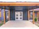 A concrete carport featuring recessed lighting, a double door entry to the home, and shuttered windows at 1200 Grace Ave, Kannapolis, NC 28083