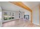 Bright living room with refinished hardwood floors and a fireplace for cozy gatherings at 1200 Grace Ave, Kannapolis, NC 28083