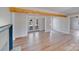 The spacious open floor plan features wood floors and plenty of natural light at 1200 Grace Ave, Kannapolis, NC 28083