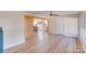 Open-concept living room with hardwood floors, decorative wood beam, and view to the kitchen at 1200 Grace Ave, Kannapolis, NC 28083