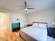 Bright bedroom featuring hardwood floors, ceiling fan, and minimalist decor at 1207 Lakedell Dr, Charlotte, NC 28215