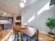 Bright dining room features a wooden table, chairs, and stylish lighting at 1207 Lakedell Dr, Charlotte, NC 28215