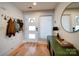 Inviting entryway with wood floors, a stylish mirror, and modern decor, creating a warm welcome at 1207 Lakedell Dr, Charlotte, NC 28215