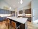 Stylish kitchen featuring a large island with seating and stainless steel appliances at 1207 Lakedell Dr, Charlotte, NC 28215