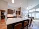 Bright kitchen showcases an island with seating, stainless steel appliances, and hardwood floors at 1207 Lakedell Dr, Charlotte, NC 28215
