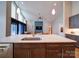 Sleek kitchen island featuring modern fixtures, with a view of the bright, open-concept living space at 1207 Lakedell Dr, Charlotte, NC 28215