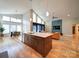 Open kitchen layout with large island, stainless steel dishwasher, and dining area at 1207 Lakedell Dr, Charlotte, NC 28215