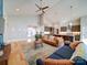 Inviting open-concept living room with hardwood floors, high ceilings, and seamless flow to the kitchen at 1207 Lakedell Dr, Charlotte, NC 28215