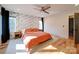 Spacious main bedroom featuring a ceiling fan and patterned accent wall at 1207 Lakedell Dr, Charlotte, NC 28215