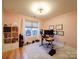 Home office featuring hardwood floors, natural light, and ceiling lighting at 1207 Lakedell Dr, Charlotte, NC 28215