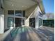 View of the back patio, exterior elevation, and backyard of the home at 1207 Lakedell Dr, Charlotte, NC 28215