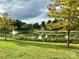 This pond area features a fountain and mature trees at 12123 Monteith Grove Dr, Huntersville, NC 28078