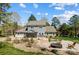Expansive backyard featuring a patio with a fire pit and inviting lounge chairs at 125 Arrow Point Ln, Davidson, NC 28036