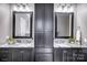 Double vanity bathroom featuring framed mirrors, granite countertop, and dark cabinets at 125 Arrow Point Ln, Davidson, NC 28036