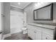 Bright bathroom with white cabinet, granite counters, tub and shower combo at 125 Arrow Point Ln, Davidson, NC 28036