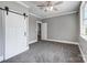 Large bedroom with sliding barn doors and connecting rooms at 125 Arrow Point Ln, Davidson, NC 28036