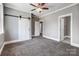 Gray bedroom with connecting doors and soft carpet at 125 Arrow Point Ln, Davidson, NC 28036