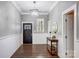 Spacious foyer features hardwood floors, wainscoting, and contemporary lighting at 125 Arrow Point Ln, Davidson, NC 28036