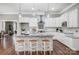 Bright kitchen featuring stainless steel appliances, stone counters and backsplash, and pendant lighting at 125 Arrow Point Ln, Davidson, NC 28036