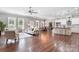 Open-concept living area seamlessly connects kitchen, dining, and living spaces with hardwood floors at 125 Arrow Point Ln, Davidson, NC 28036