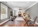 Cozy living room with fireplace, shiplap accent wall, ceiling fan, and comfortable seating area at 125 Arrow Point Ln, Davidson, NC 28036