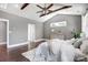 Spacious main bedroom features vaulted ceiling with fan, hardwood floors, and neutral paint at 125 Arrow Point Ln, Davidson, NC 28036