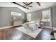 Comfortable main bedroom with vaulted ceiling, natural light, and neutral decor for a relaxing retreat at 125 Arrow Point Ln, Davidson, NC 28036