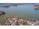Expansive aerial view of a luxury waterfront home with private dock and stunning water views at 134 Larkhaven Ln, Mooresville, NC 28117
