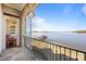 Scenic balcony with black metal railings overlooking the serene waterfront and private dock at 134 Larkhaven Ln, Mooresville, NC 28117