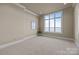 Spacious bedroom featuring a large window with gorgeous water view and neutral decor at 134 Larkhaven Ln, Mooresville, NC 28117