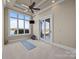 Bonus room with a ceiling fan, an access door, and a large window with a beautiful view at 134 Larkhaven Ln, Mooresville, NC 28117