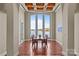 Elegant dining room with large windows offering breathtaking views of the lake at 134 Larkhaven Ln, Mooresville, NC 28117