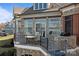 Exterior elevation showcasing a stone patio, a grill, and a lake view at 134 Larkhaven Ln, Mooresville, NC 28117