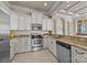 Modern kitchen with stainless steel appliances, granite countertops, custom cabinets and recessed lighting at 134 Larkhaven Ln, Mooresville, NC 28117