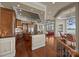 Open-concept kitchen and living area featuring dark wood cabinets and scenic water views at 134 Larkhaven Ln, Mooresville, NC 28117