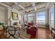 Beautiful living room with fireplace, coffered ceilings, hardwood floors, and natural light at 134 Larkhaven Ln, Mooresville, NC 28117