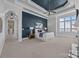 Spacious bedroom with tray ceilings, a fireplace, and access to a walk in closet at 134 Larkhaven Ln, Mooresville, NC 28117