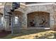 Covered patio with hanging chairs and a spiral staircase at 134 Larkhaven Ln, Mooresville, NC 28117