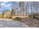 Expansive backyard with a patio area and mature trees, offering a serene and private outdoor retreat at 158 Crimson Orchard Dr, Mooresville, NC 28115