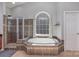 A luxurious bathroom with a soaking tub, a glass-enclosed shower, and elegant tile work at 158 Crimson Orchard Dr, Mooresville, NC 28115