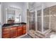 A bathroom featuring a vanity with a dark countertop and a glass-enclosed shower at 158 Crimson Orchard Dr, Mooresville, NC 28115