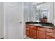 A bathroom featuring a vanity with a dark countertop and a view into another part of the bathroom at 158 Crimson Orchard Dr, Mooresville, NC 28115