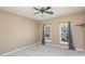 An empty bedroom showcasing neutral walls, plush carpet, and natural light from two windows at 158 Crimson Orchard Dr, Mooresville, NC 28115
