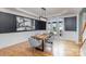Formal dining room featuring hardwood floors and a modern chandelier at 158 Crimson Orchard Dr, Mooresville, NC 28115